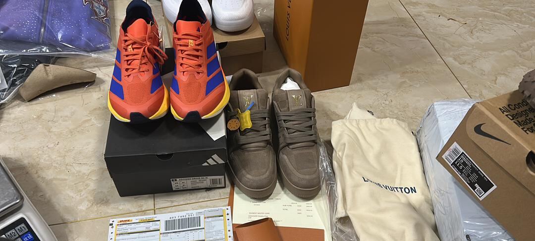 Adidas Adizero running shoes and Louis Vuitton Trainer with LV dust bag in shipment