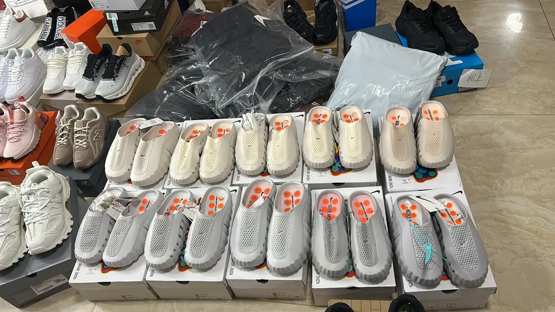 Nike Calm slippers and other sneakers in the supplier warehouse